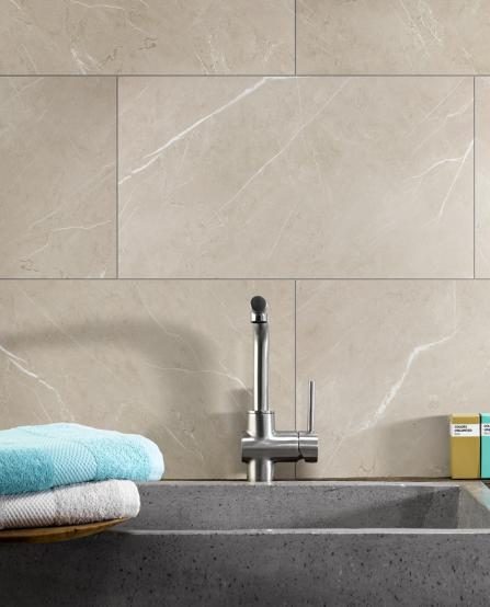 Barwick composite wall tiles behind a kitchen sink and counter top.